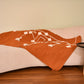 This 1 x 1.5 meter rug features a bold, Coral background and a striking white geometric pattern that consists of interconnected diamond shapes, creating a visually engaging composition. The edges are adorned with fringed tassels made of the same material, contributing to the traditional and artisanal aesthetic.